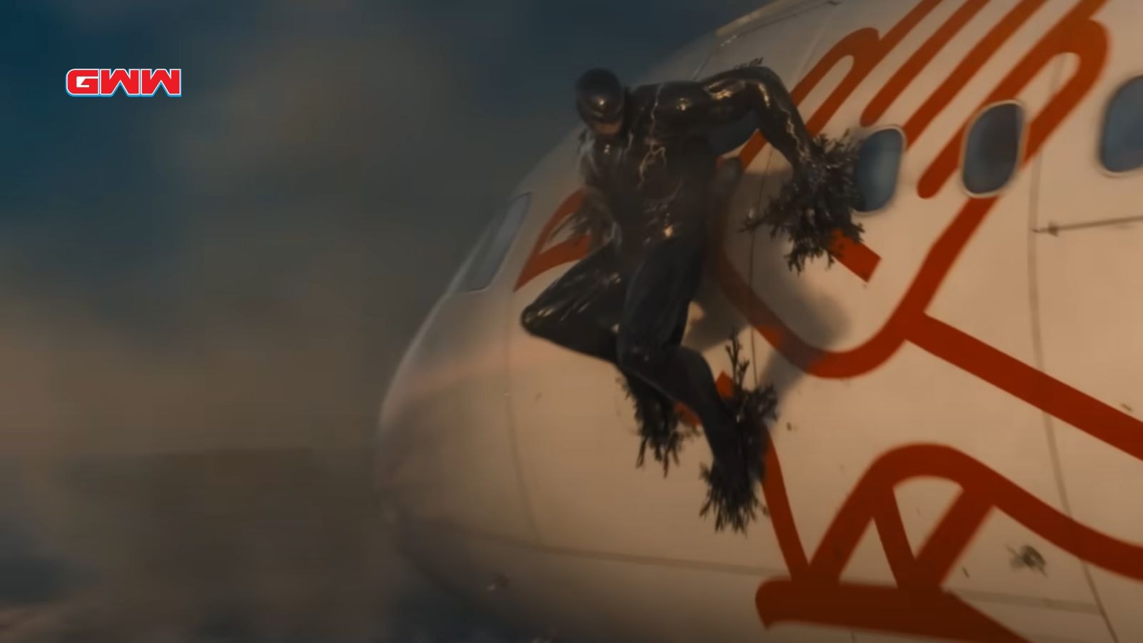 Venom clings to the side of an airplane.