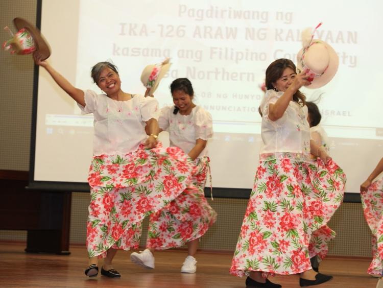 A group of women dancingDescription automatically generated