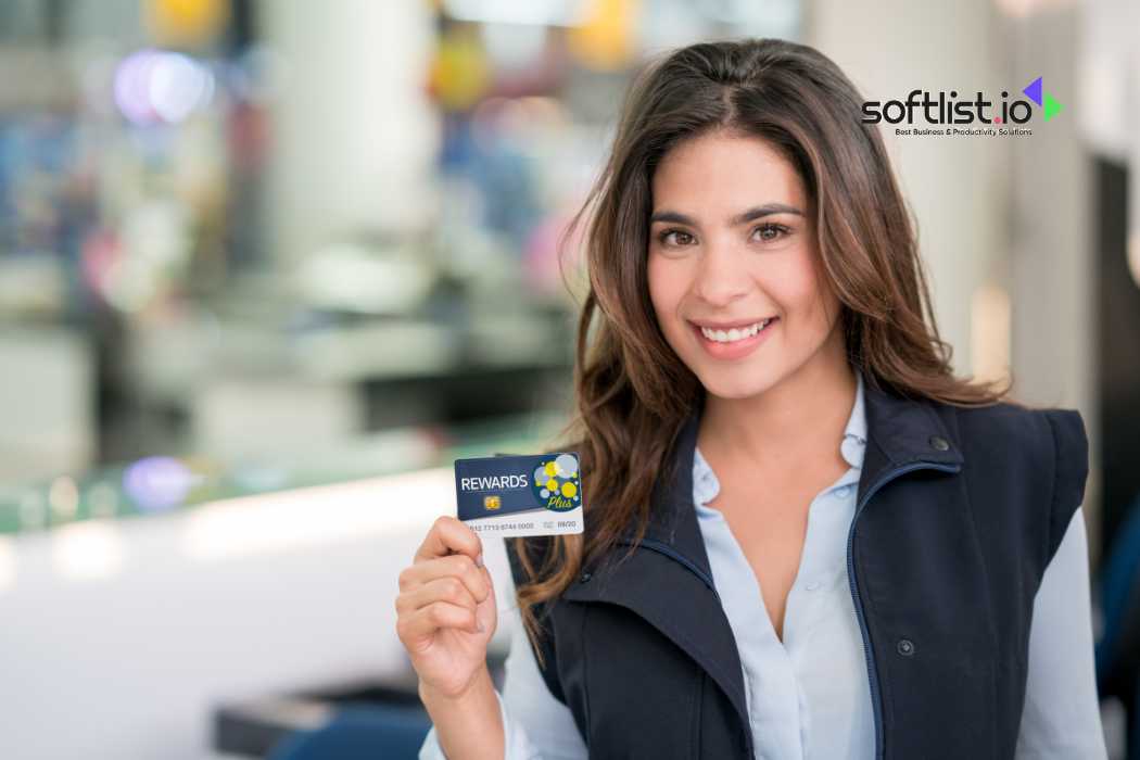 Smiling woman holding rewards card, retail environment