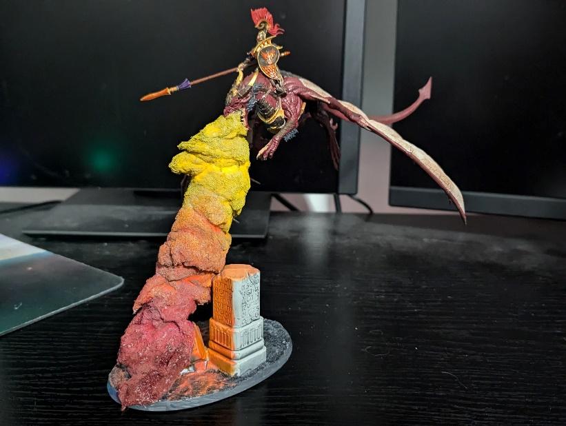 A toy figurine on a table Description automatically generated