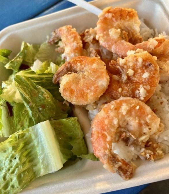 A plate of food with shrimp and rice

Description automatically generated