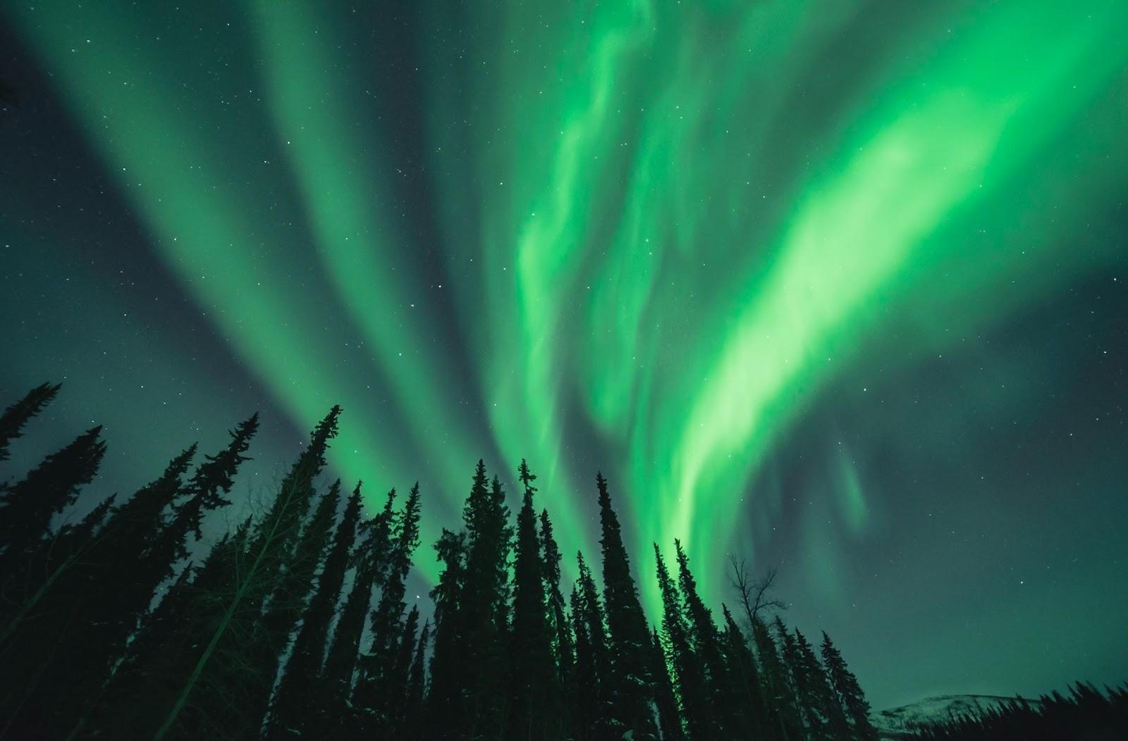 Arctic landscape with Northern Lights across the sky