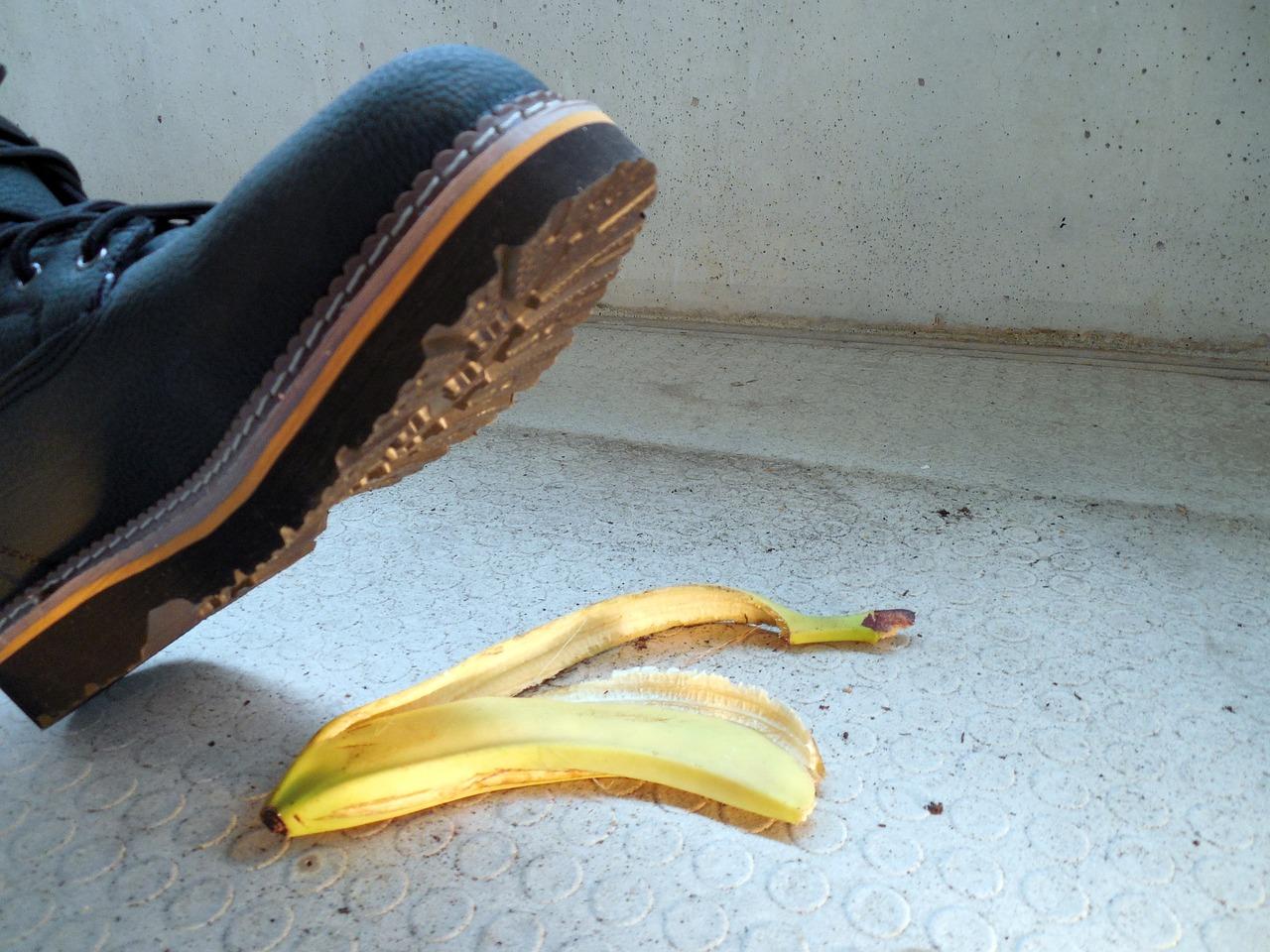 A shoe and peel of a banana</p>
<p>Description automatically generated