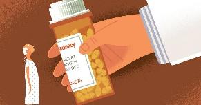 A hand holding a bottle of pills

Description automatically generated