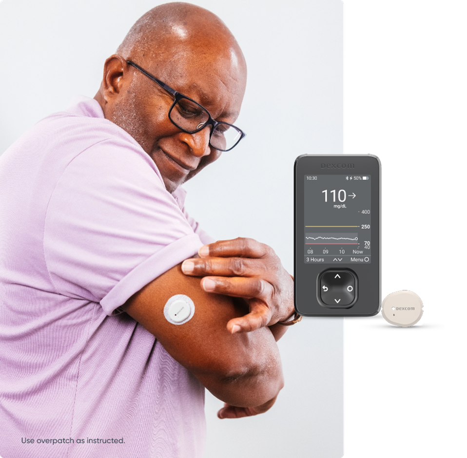 Older man with CGM and image of glucose level being displayed on a smartphone