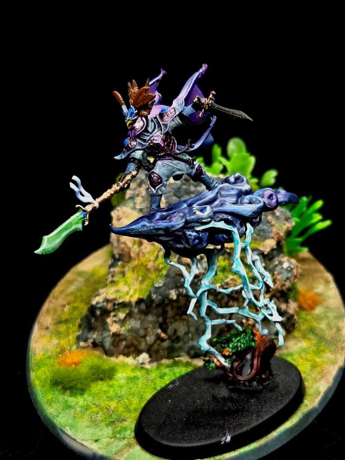 A toy figurine of a warrior holding a sword Description automatically generated