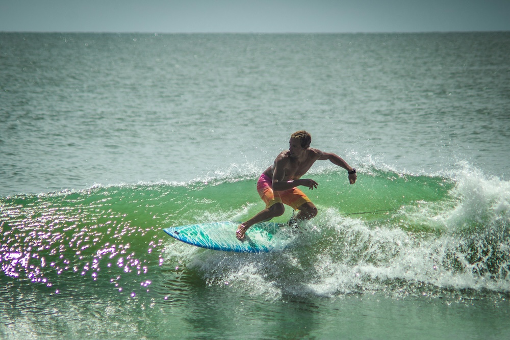 Man surfing at Ocean Isle Beach