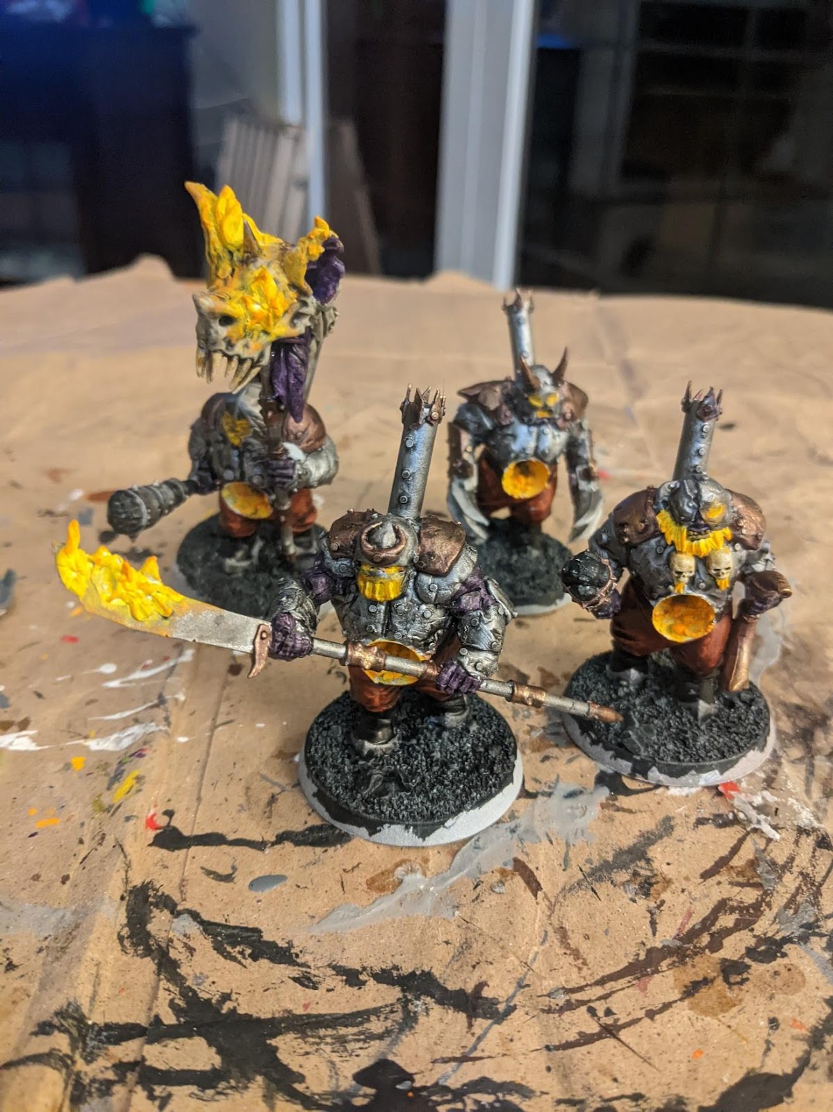 A group of small figurines on a table  Description automatically generated