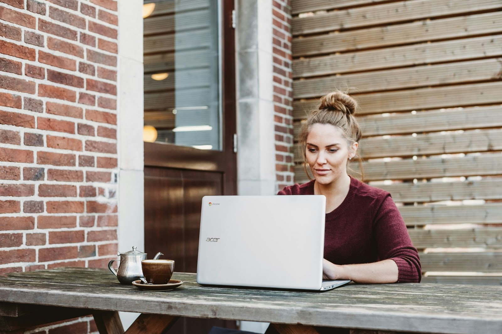 Woman working on her laptop outdoors