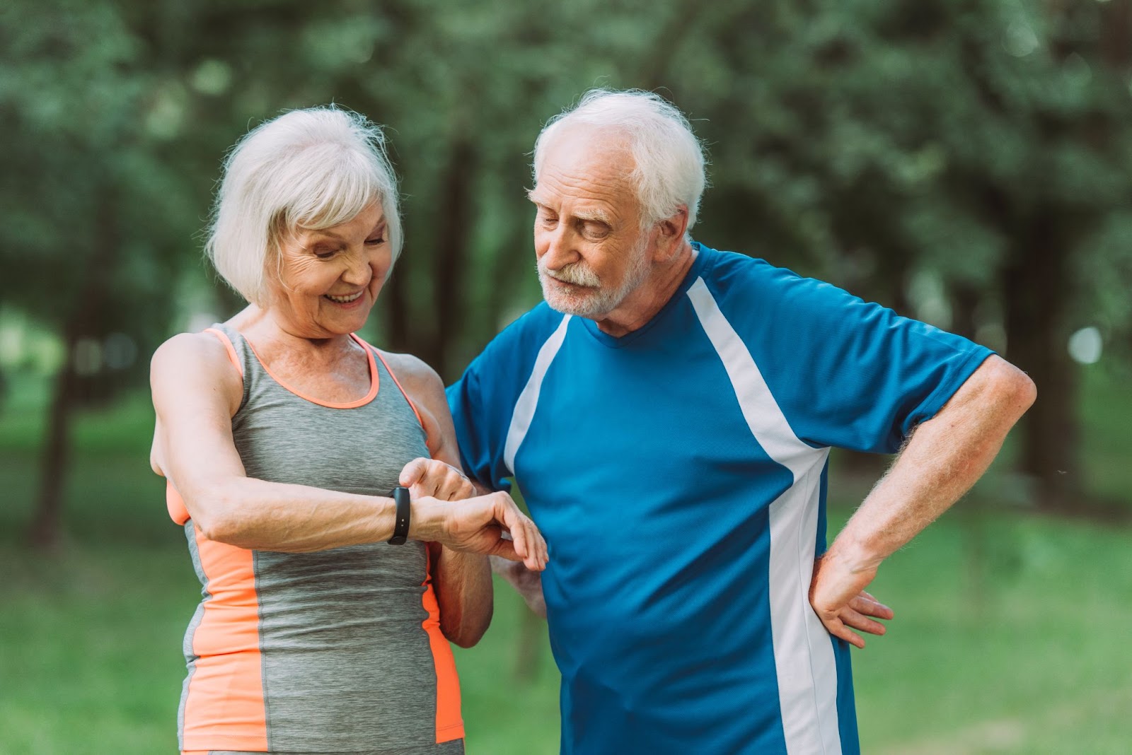 Active residents at an assisted living community using their smartwatches to monitor fitness during physical activities.