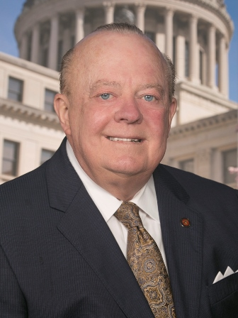 the melted-seeming face of Mississippi state Senator John Polk