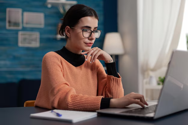 A girl working on a laptop