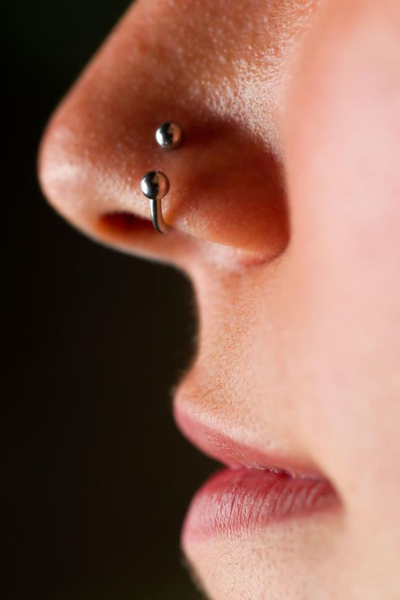 Side view of a lady wearing the nose ring