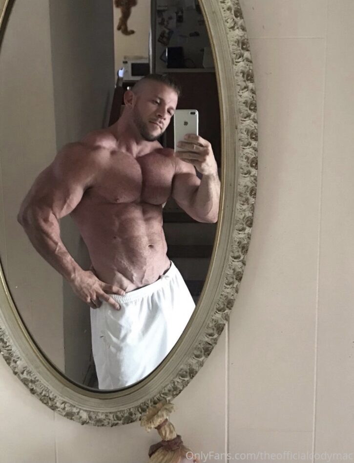 Cody Mac taking an iphone mirror selfie in white shorts shirtless showing off his bulge for gay xxx onlyfans content