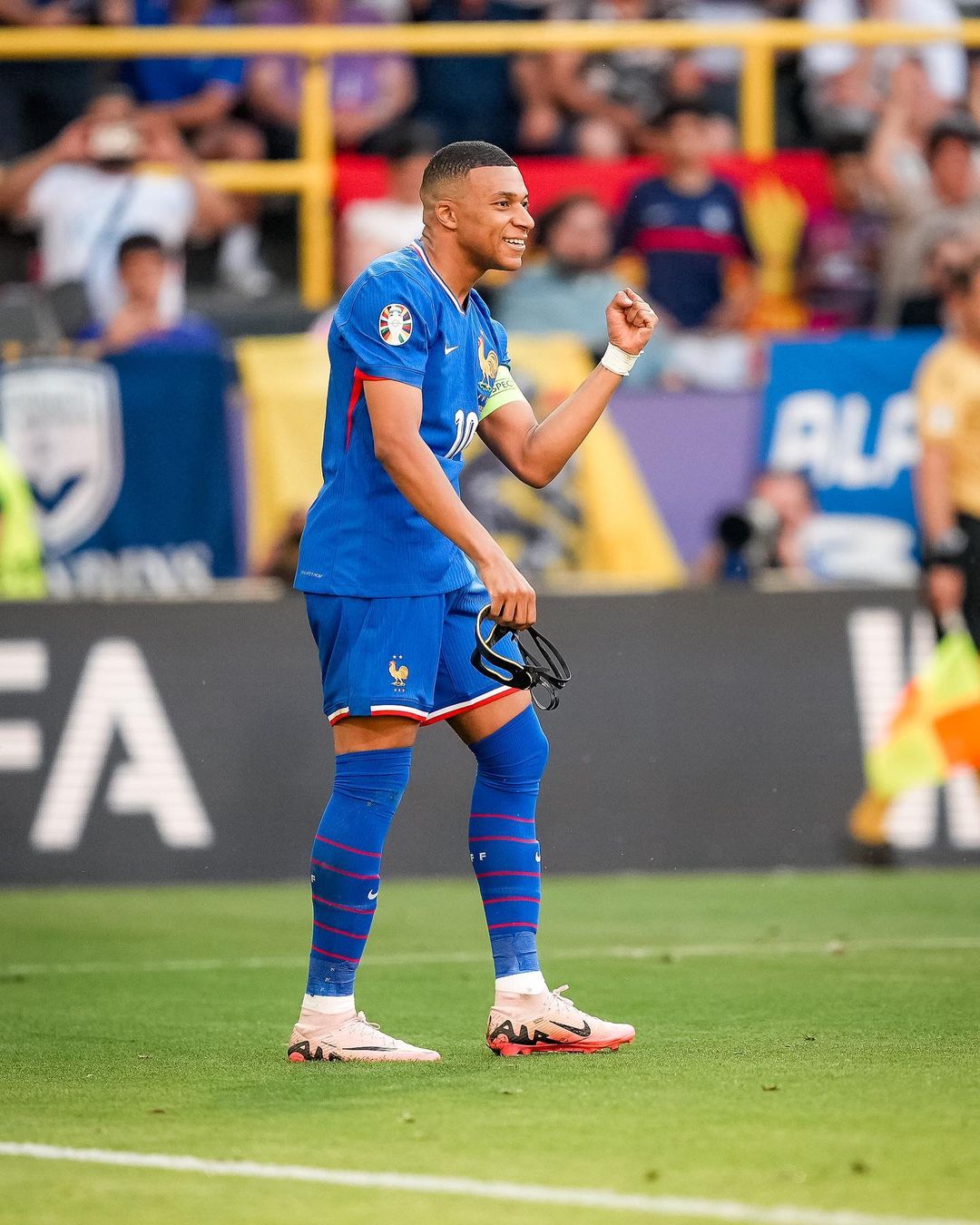 Photo by Kylian Mbappé on June 25, 2024. May be an image of 2 people, people playing football, people playing soccer, stadium and text.