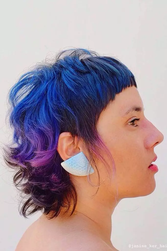 Side views of a lady  wearing the  blue short  layered haircuts