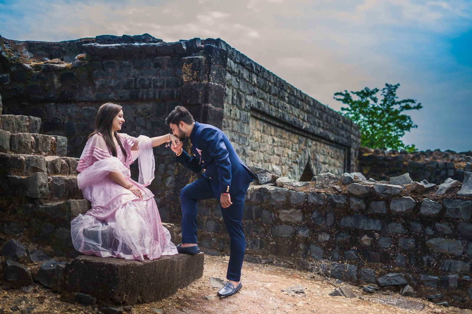 Pre-wedding shoot featuring a hand kiss, captured in Mandu near Indore. Photograph taken by Harsh Studio Photography, a premier wedding photographer in Indore, Madhya Pradesh, India. Known for their exceptional services and expertise in capturing memorable moments."