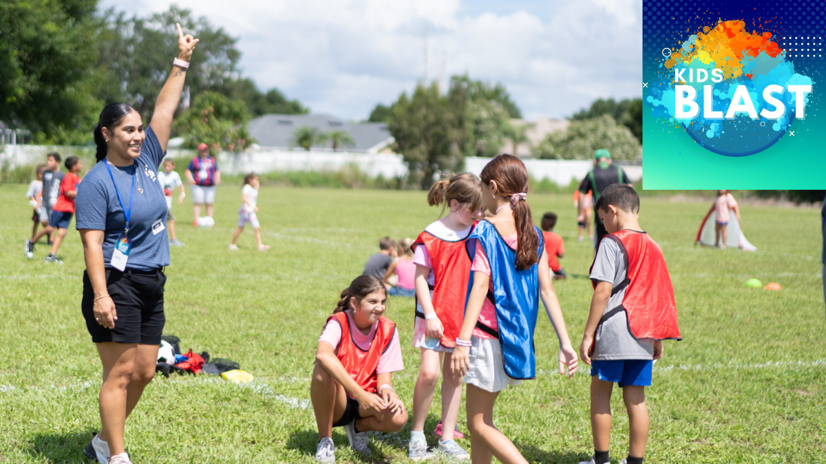 A group of kids on a field

Description automatically generated