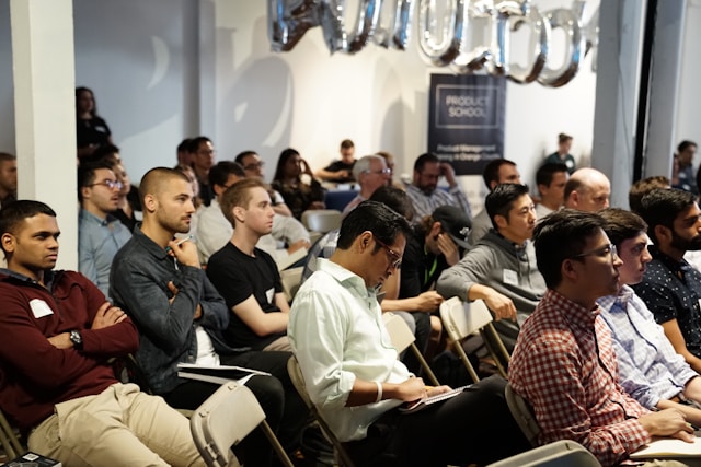 Group of professionals attending a seminar or forum.