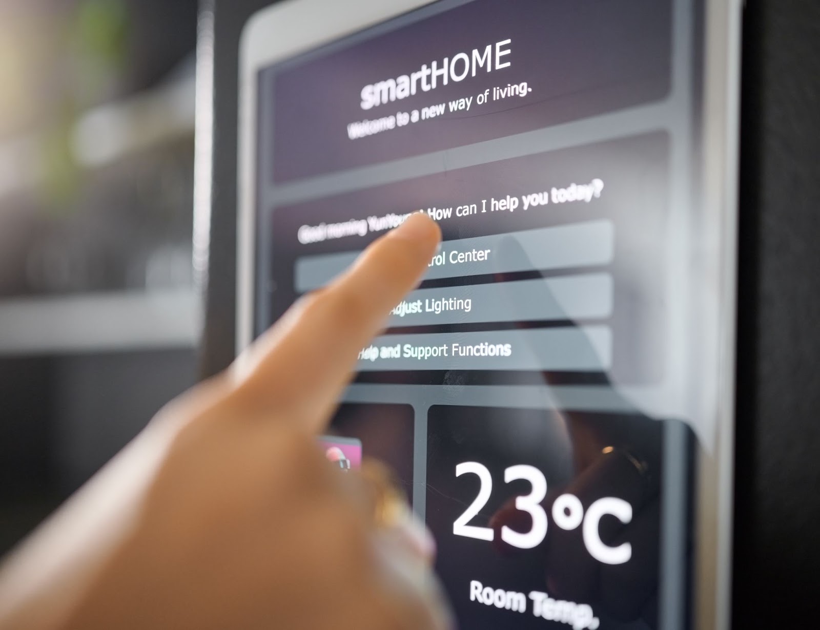 A woman's hand seamlessly adjusting the thermostat setting on a wall-mounted digital app using smart technology.