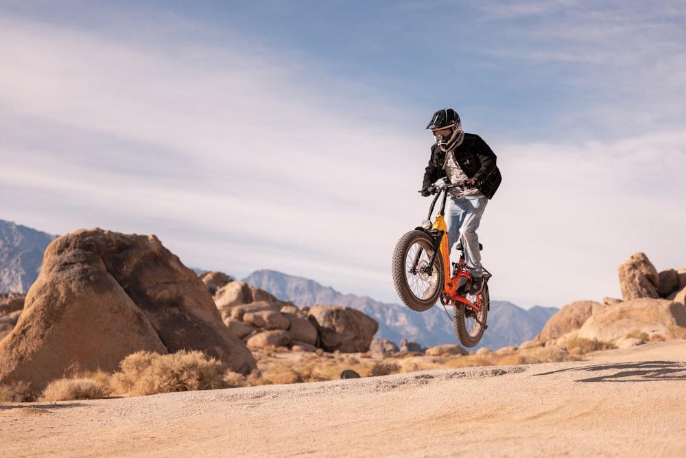 a person jumping a dirt bike in the air