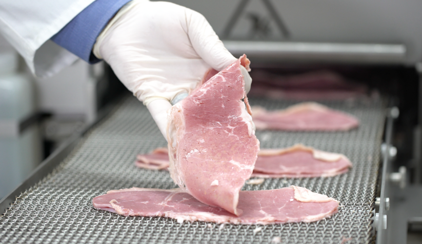 Food manufacturer admiring the consistent meat slices from the 613 Multi-Slicer