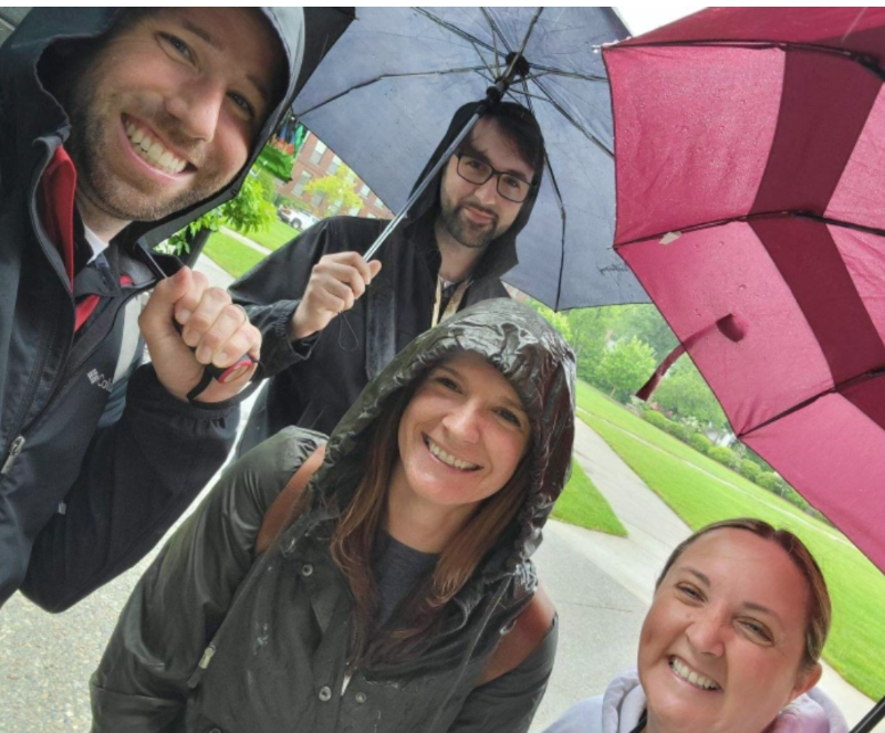  image of students  touring university in the rain  
