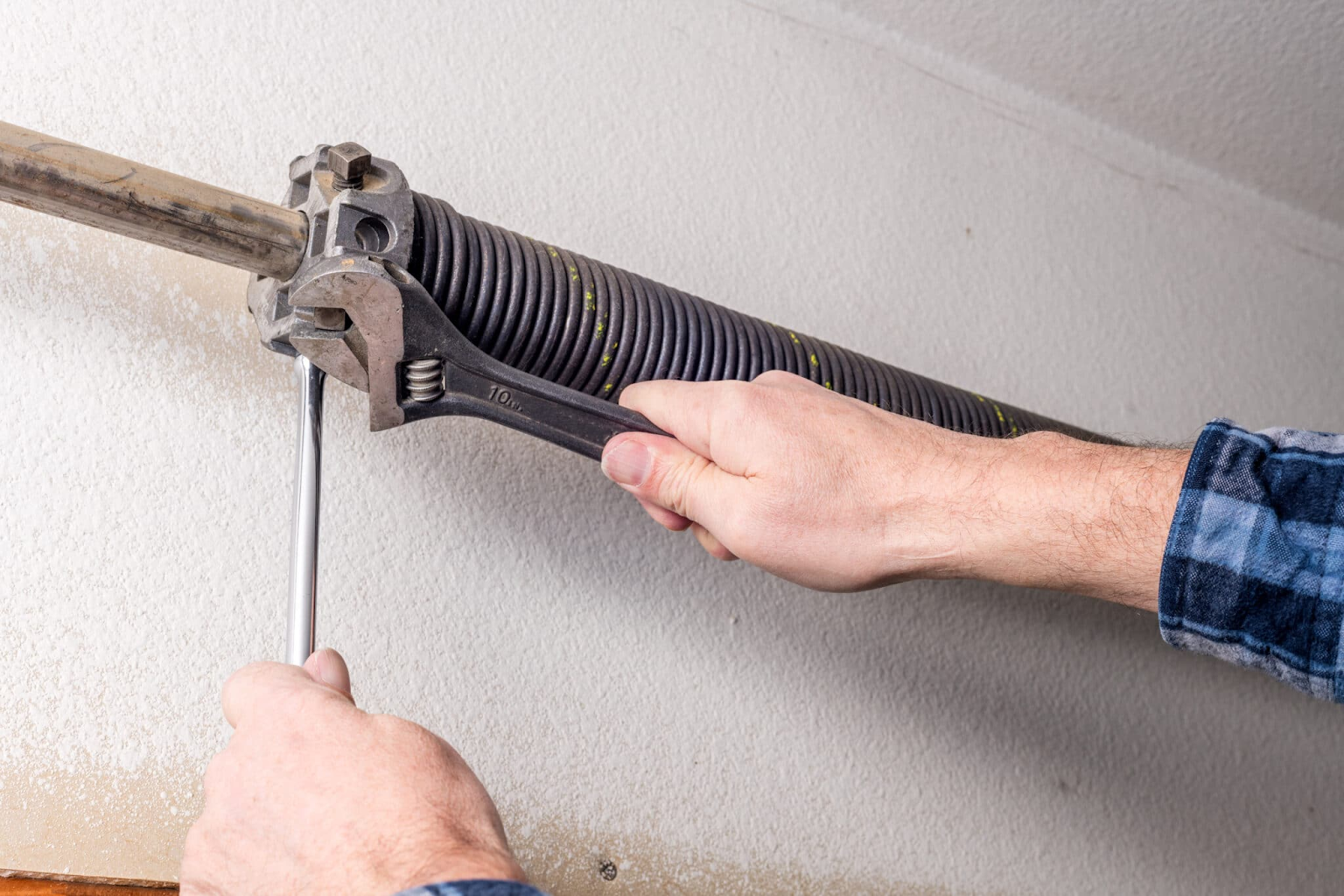 how to change garage door spring