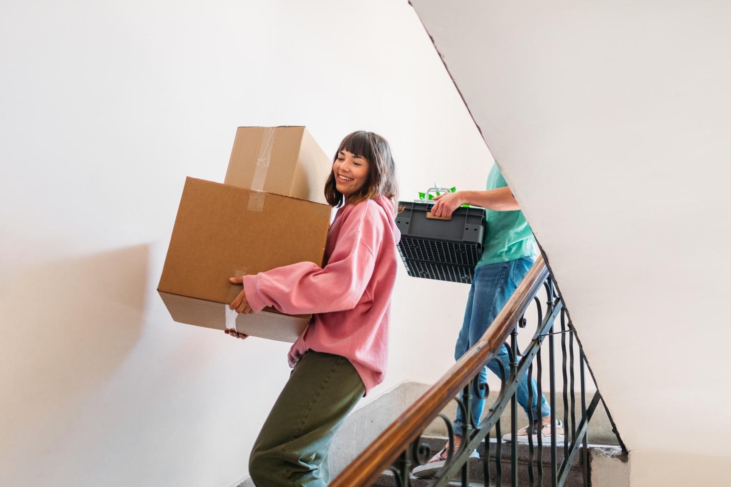 People carrying moving boxes