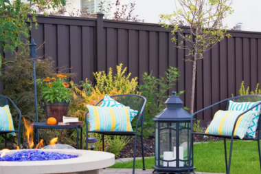 comparing common fencing materials trex composite fence with fire pit and outdoor furniture custom built michigan