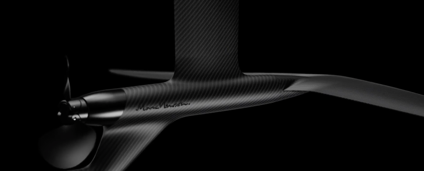 A close-up of a black carbon fiber object

Description automatically generated