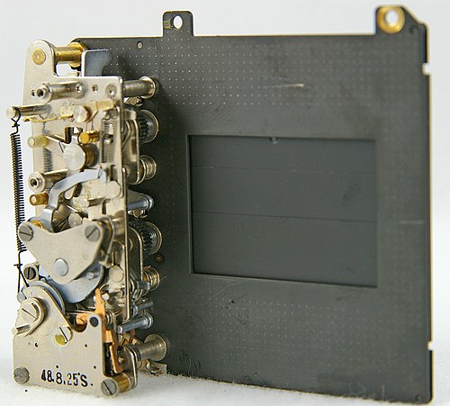 A disassembled digital camera, showing the complex arrangement of parts that capture and process images.