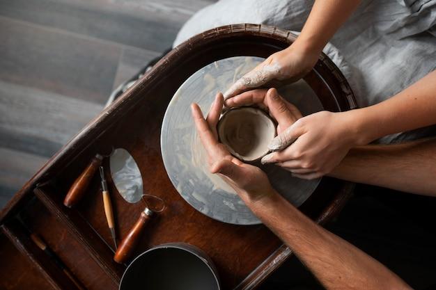 Sculptor artist working with clay in the studio