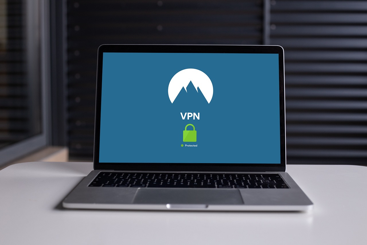 A laptop screen displaying a VPN logo with a green padlock icon and the word "Protected."
