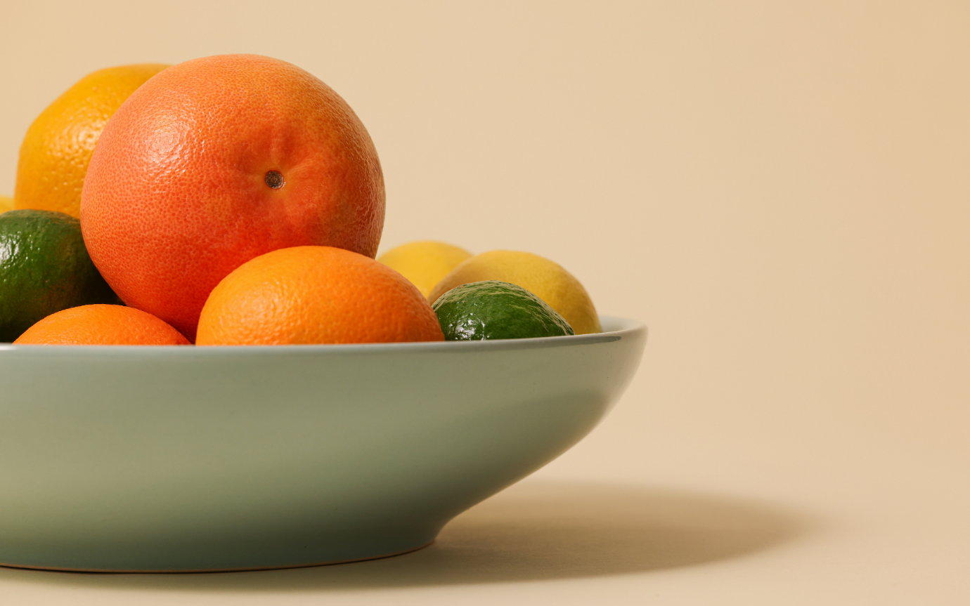 A bowl of fruit on a tableDescription automatically generated