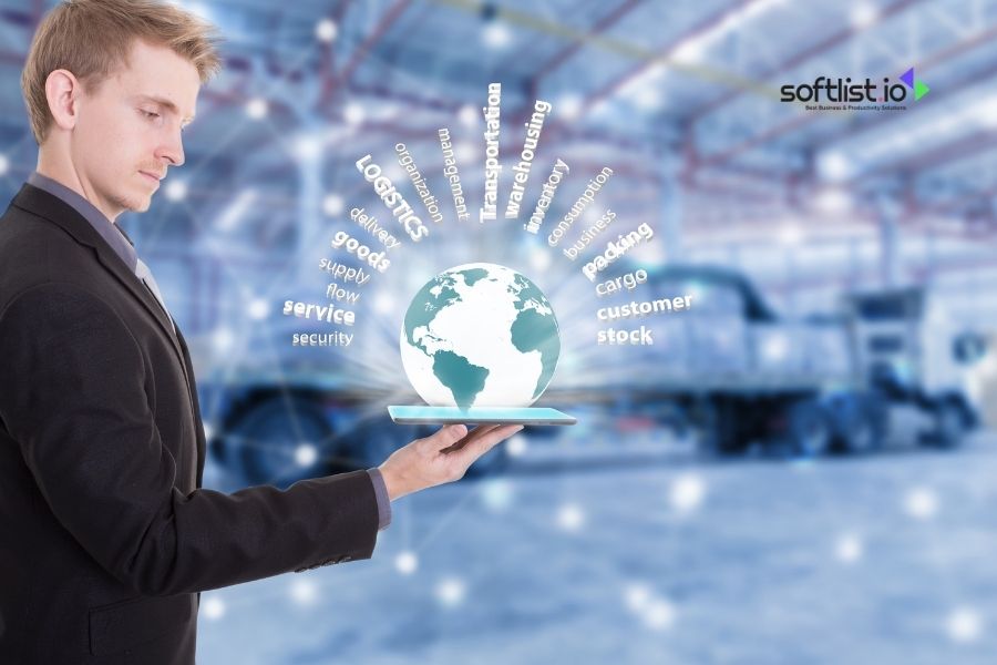 Man holding a globe with logistics-related terms surrounding it.