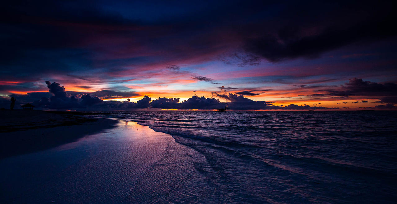 Sunset transitioning to dark over a beach in The Bahamas.