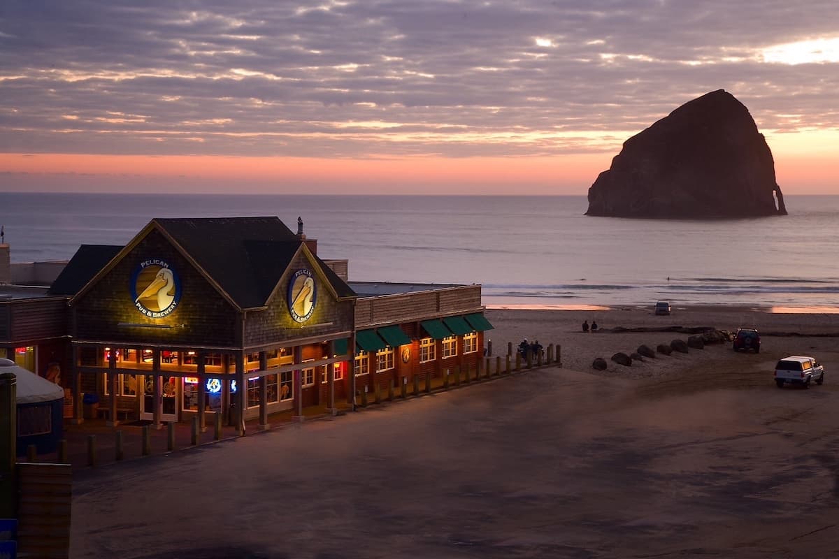 sunset with large Haystack Rock in the ocean