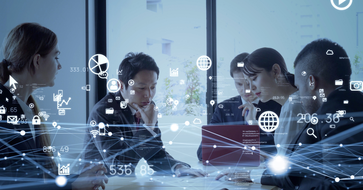A professional team discusses Agile transformation strategies around a whiteboard with charts and graphs, highlighting agile training and Scrum Master training.