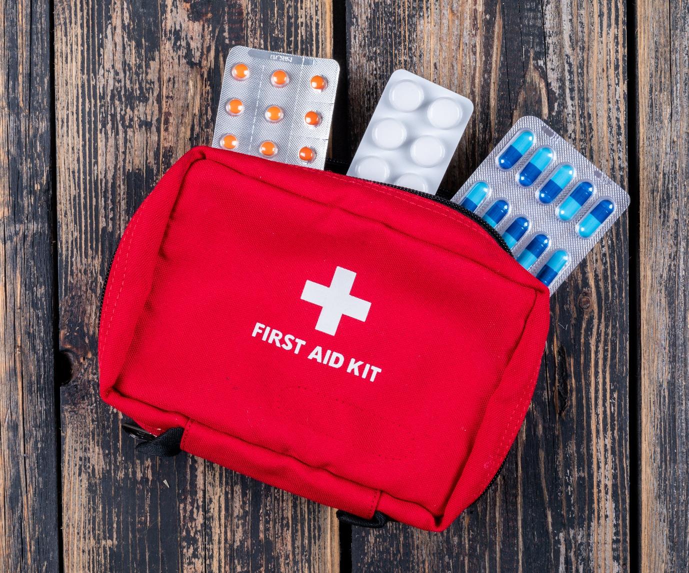 C:\Users\urvashi.moolchandani\Downloads\first-aid-kit-with-pills-top-view-dark-wooden-background.jpg