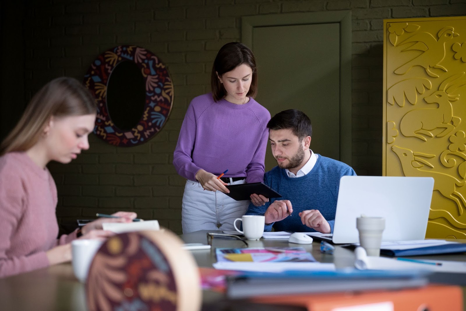 A group of people working together in an office