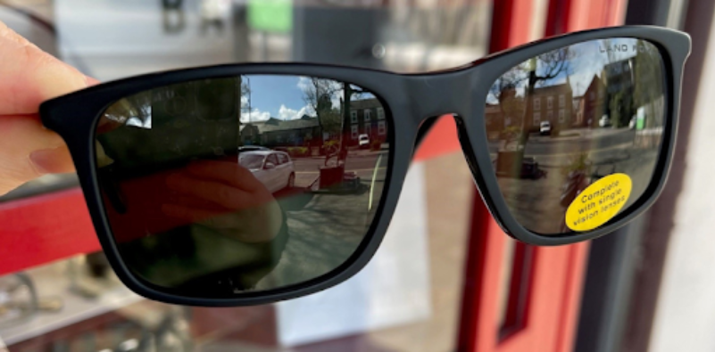 A pair of sunglasses on a window

Description automatically generated