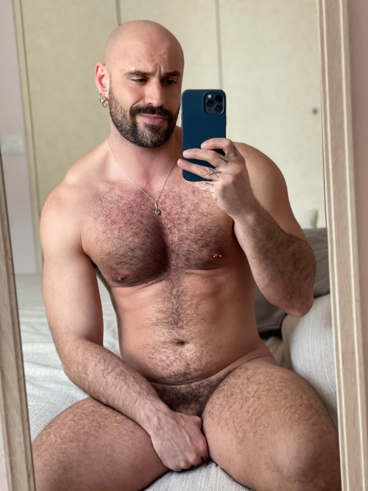Mister Caccamo sitting on the bed naked taking an iphone mirror selfie covering his hot flaccid cock with his hand