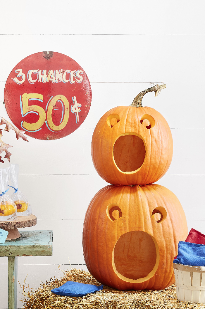 pumpkin carving ideas, two pumpkins stacked with open mouths and carved eyes