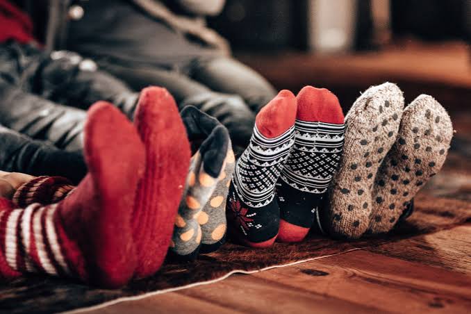 Sitting on a Covered with Socks on