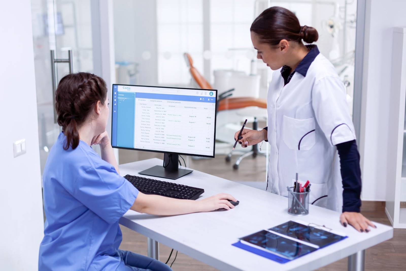 2 Nurses Assessing a Medical Software 