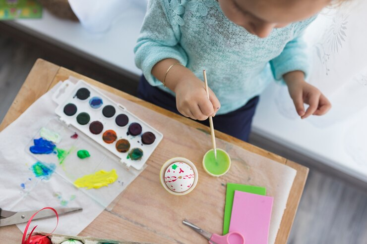 Engaging preschoolers in creative STEM activities with paint in kindergarten.