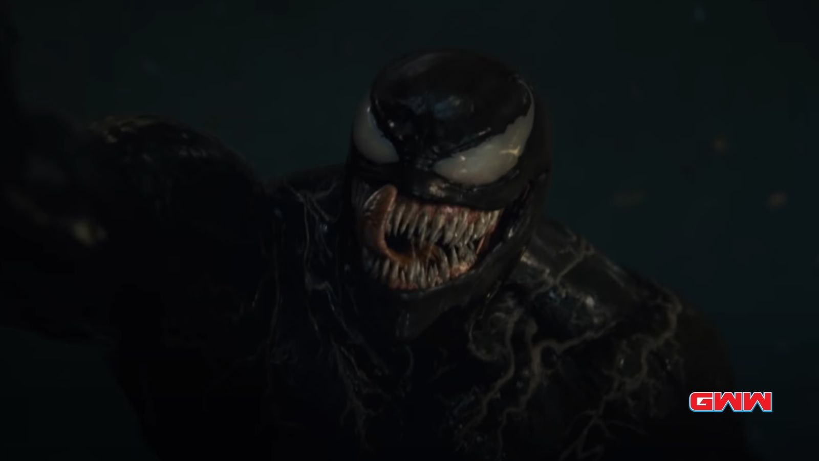 A dark, menacing Venom with sharp teeth and white eyes.