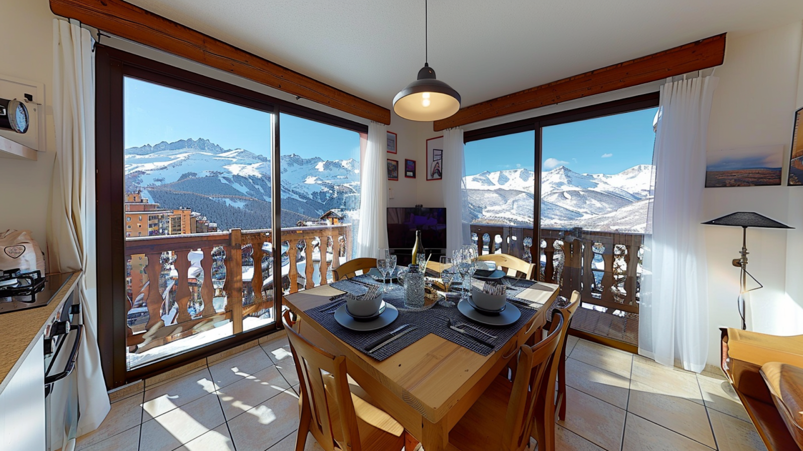 The dining area of a secluded vacation rental with mountain views in Courchevel, France.