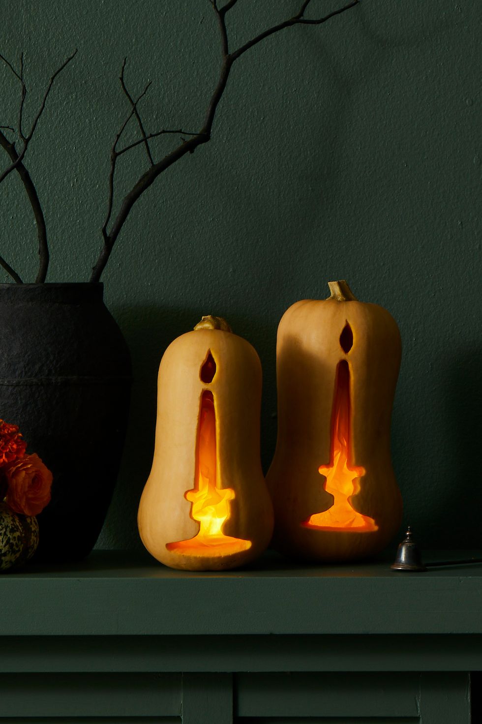 pumpkin carving ideas, two pumpkins on the mantel carved to look like candles